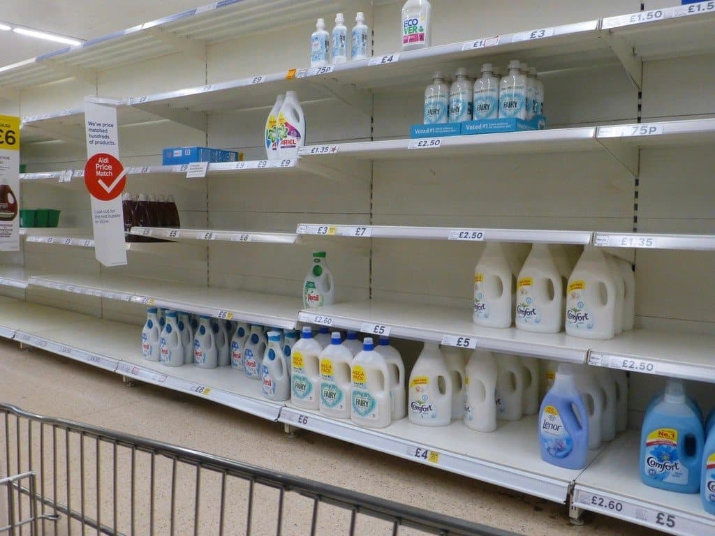 Supermarket shelf with empty sections marked by a grid